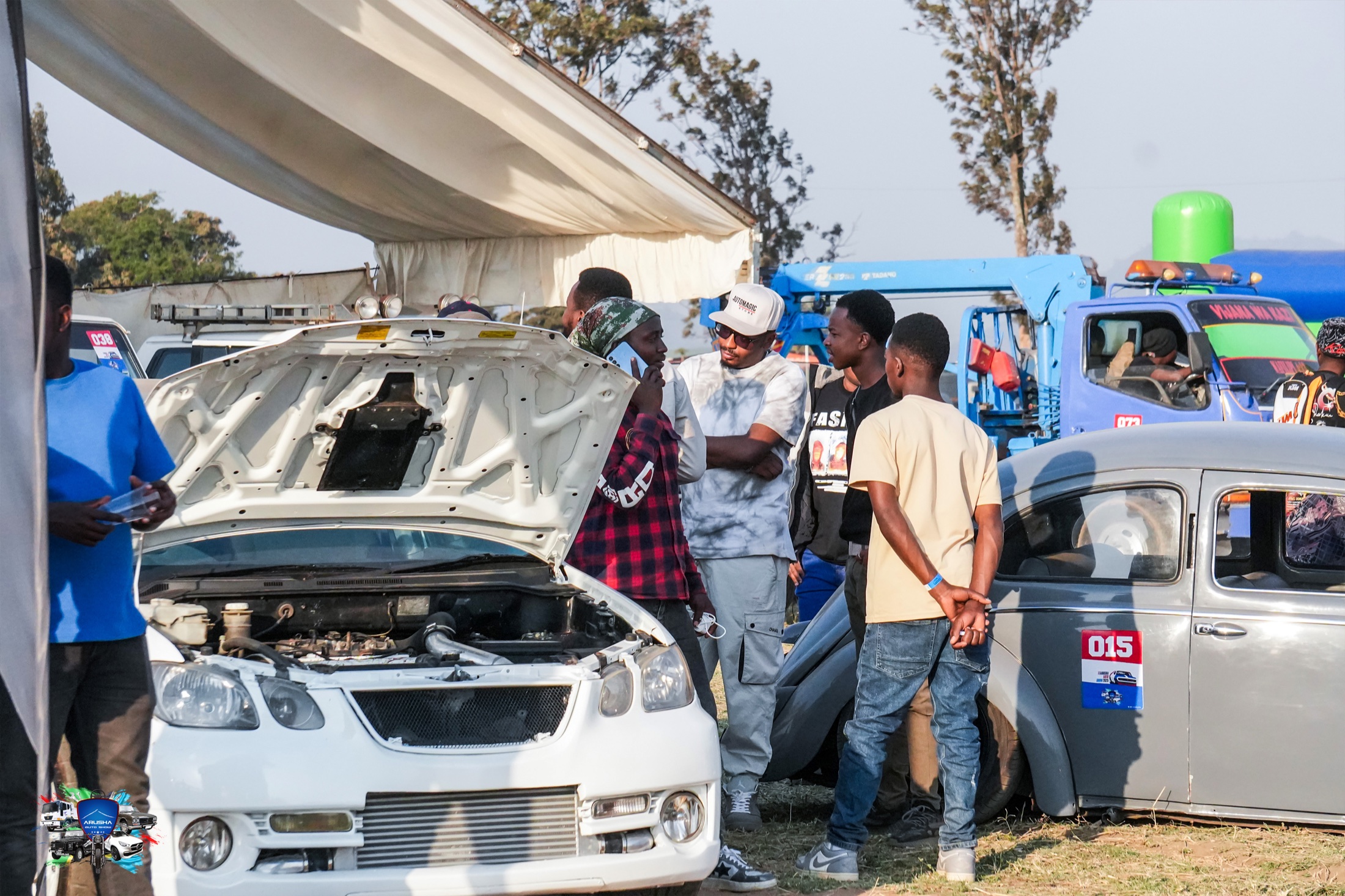 Arusha Auto Show outdoor automotive festival crowd and vehicles
